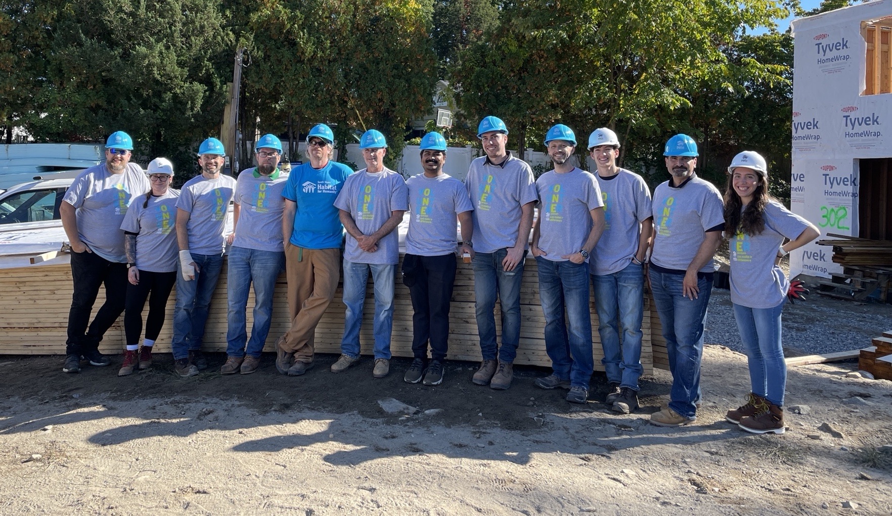 The CopelandBEC team enjoying a build day at Habitat for Humanity with our friends from Tripi Engineering.