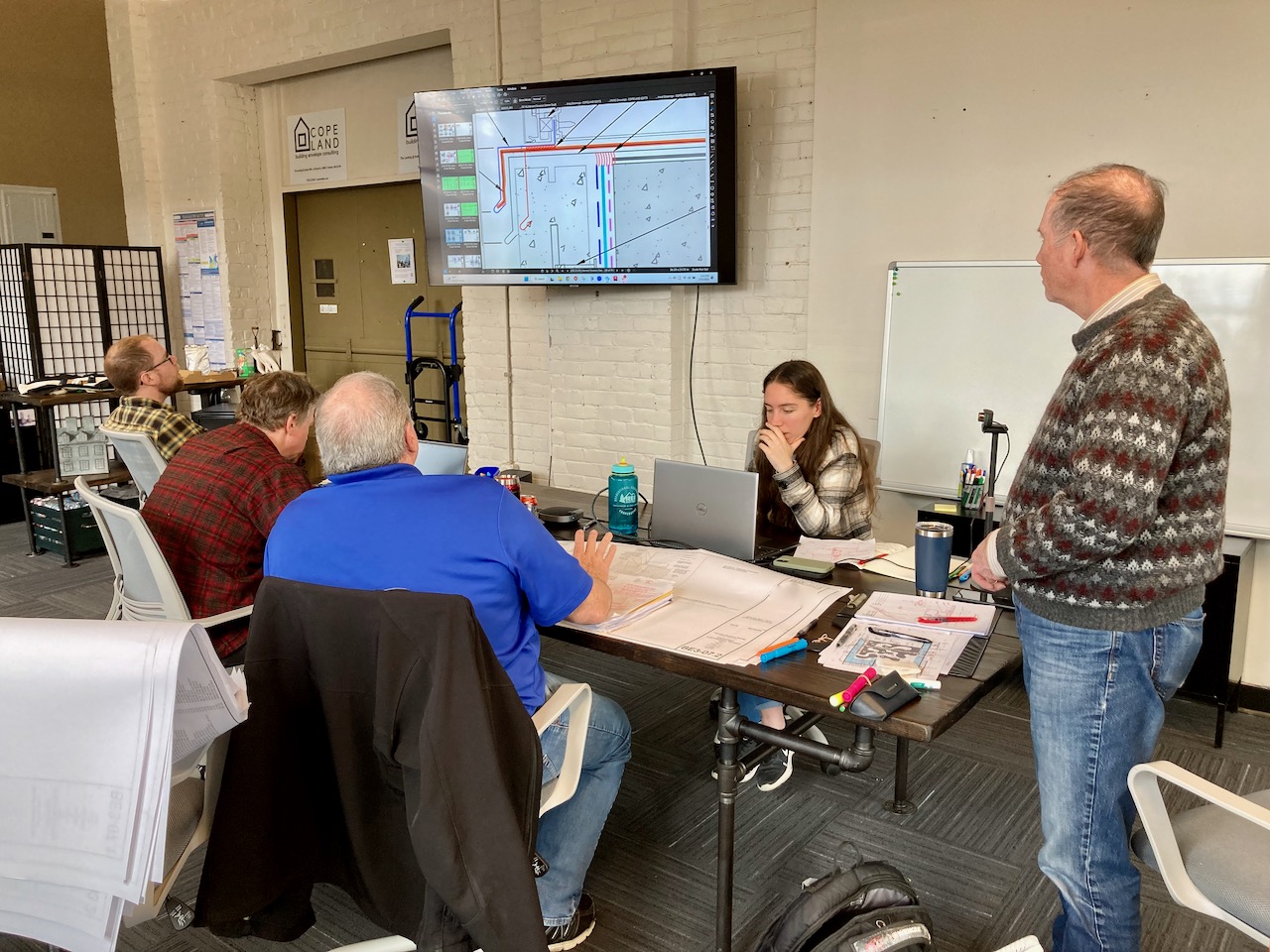 members of the CopelandBEC team working through a design challenge in our Hudson office