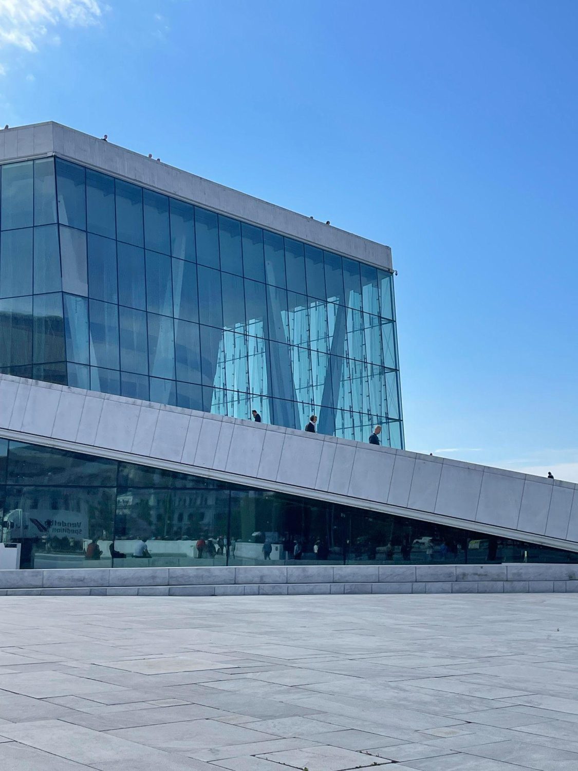 The glass-and-marble facade of the Oslo Opera House